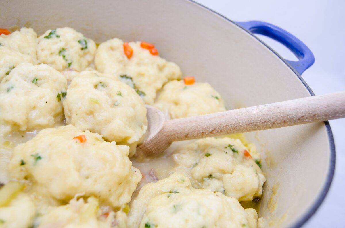 Old Fashioned Chicken and Dumplings is a delicious homemade meal. Tender dumplings are made from scratch and simmered in a delicious chicken broth.