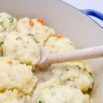Old Fashioned Chicken and Dumplings is a delicious homemade meal. Tender dumplings are made from scratch and simmered in a delicious chicken broth.